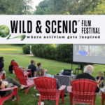 group watches film outdoors